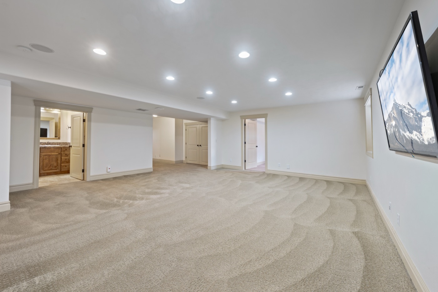 Lower level wide view with bedroom entries